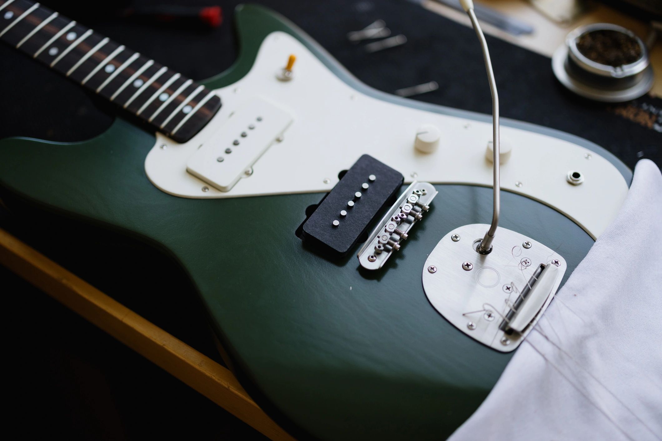 Electric guitar electronics being worked on in a luthier workshop